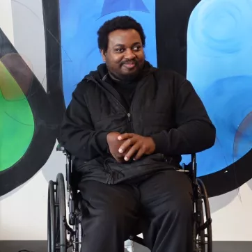 a ymca member in a wheelchair set up for an interview