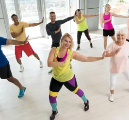 a group of people dancing in a studio