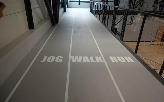 the track at the sands family ymca with the lanes labeled jog, walk, run