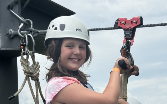Girl on a Zipline at Camp Bay View