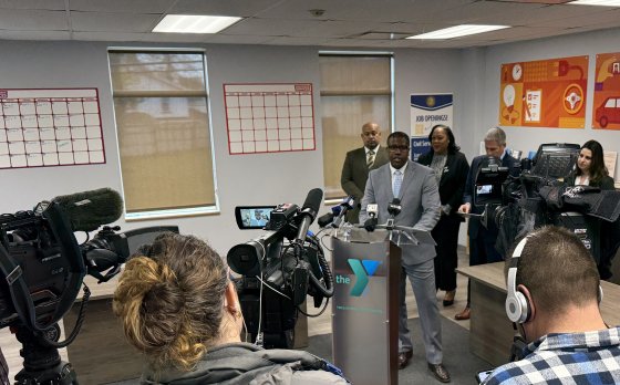 President & CEO Ernie Lamour stands in front of local media announcing the opening of a Neighborhood Services space in partnership with Monroe County