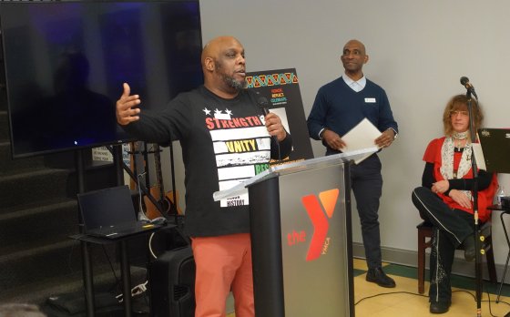 Duane Yansen speaks at the Thurston Road YMCA Neighborhood Center's Black History Month Celebration.