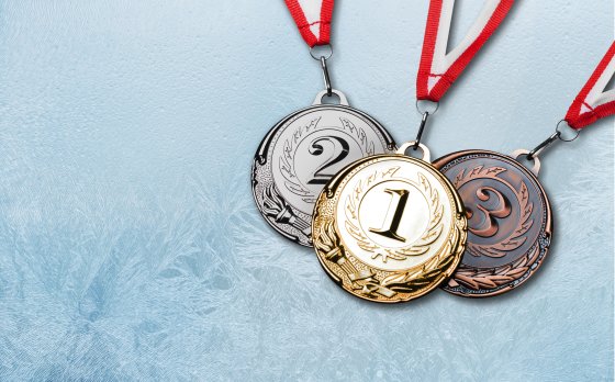 Gold, Silver and Bronze medals on frosted ice