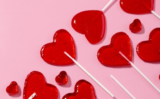 A group of heart-shaped lollipops.
