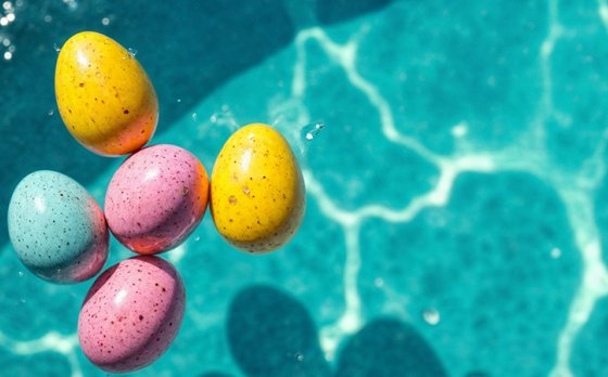 Easter eggs floating in a pool
