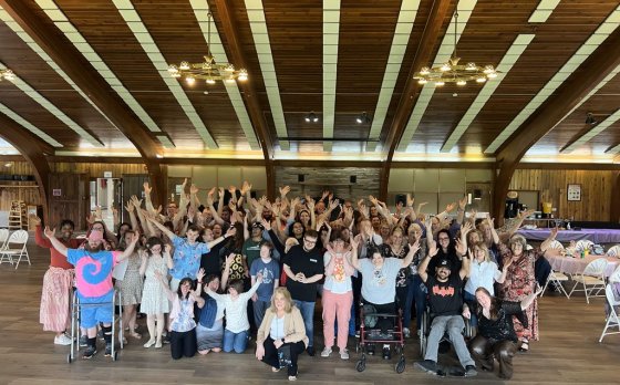 Group photo posing with arms up in excitement