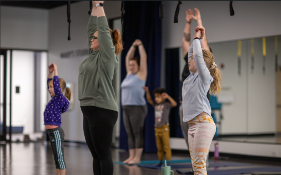 family stretching in studio
