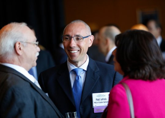 Paul LeFrois smiling in conversation