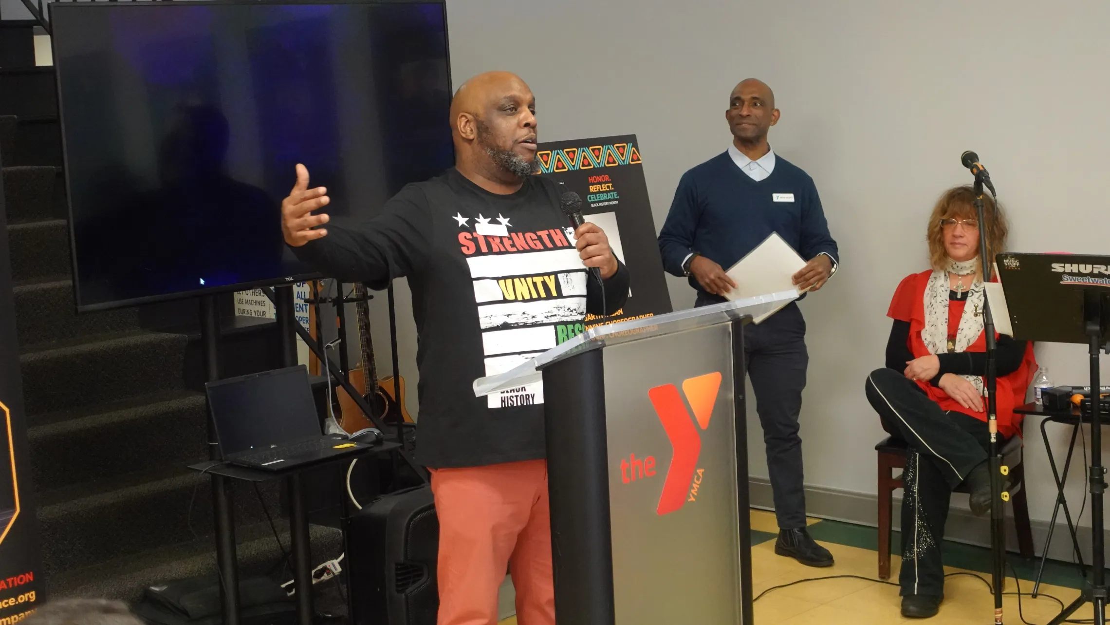 Duane Yansen speaks at the Thurston Road YMCA Neighborhood Center's Black History Month Celebration.