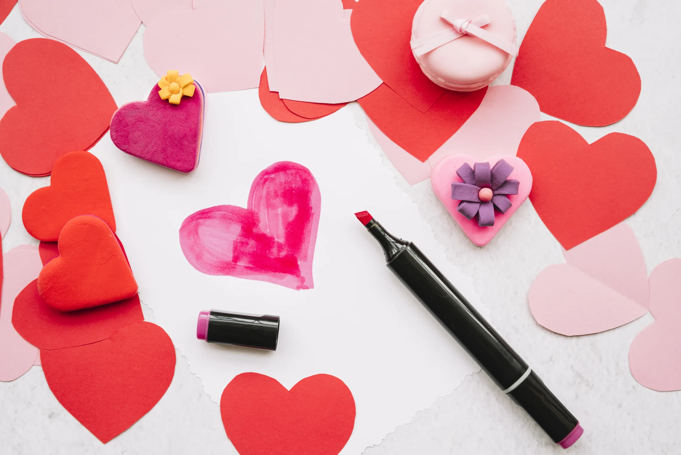 Heart painted with felt pen and Valentine's Day deocrations.