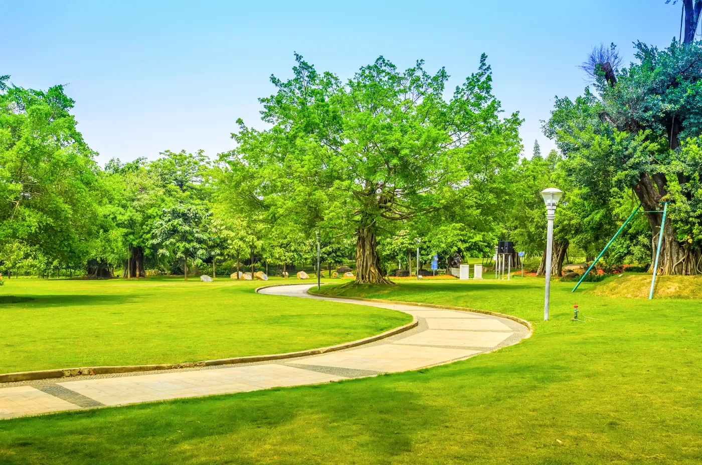 Park with pathway, trees and lamppost