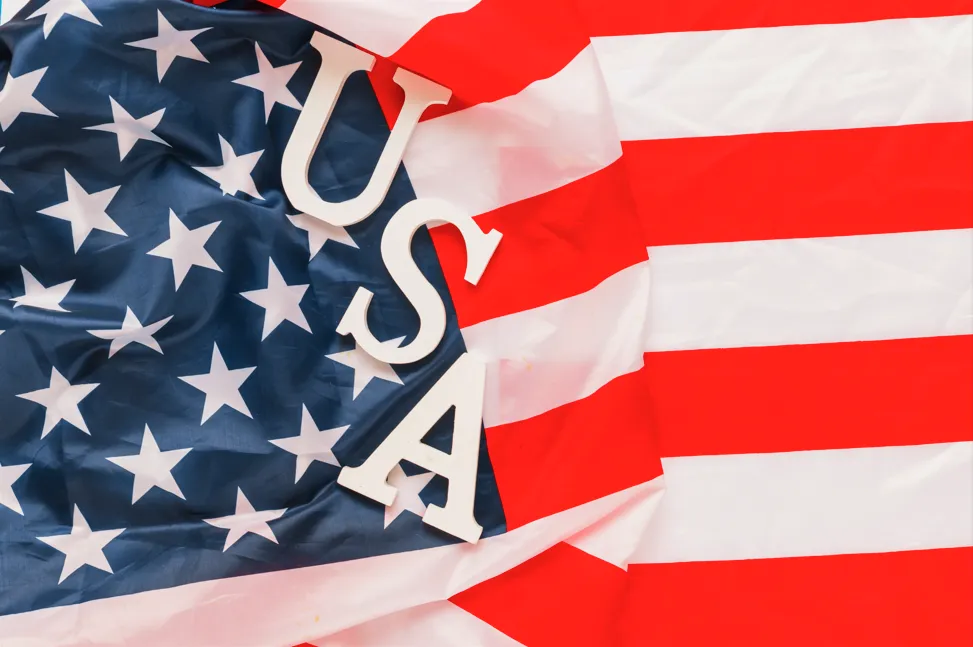 Letters spelling out "USA" on an American Flag
