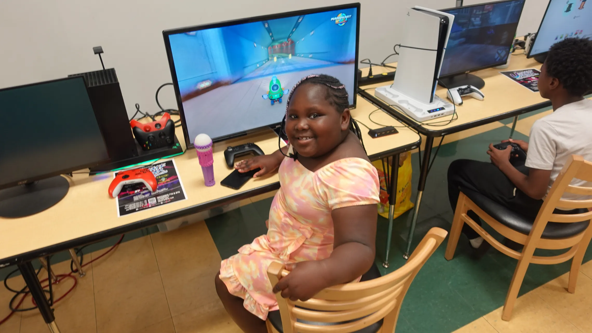 Girl playing a computer game at Thurston.