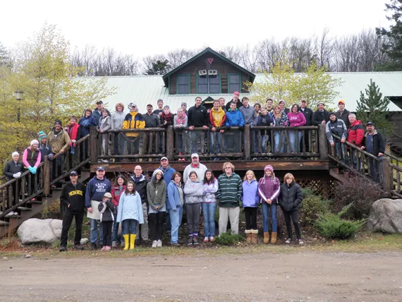 a group of families at Camp Gorham gathering for a group photo