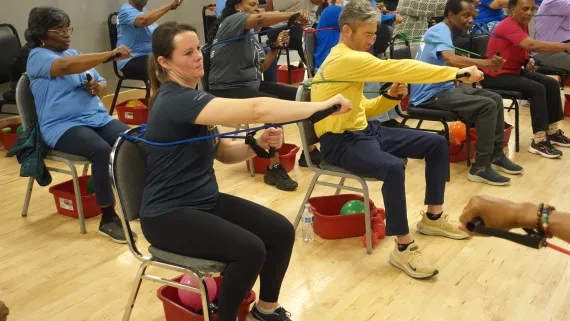 Officer Kate Girard-Flanagan joins in on Chair Yoga