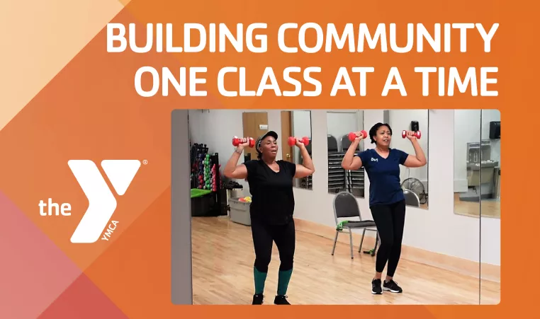a group exercise class using dumbbells in their exercise with the text "Building Community One Class at a Time"