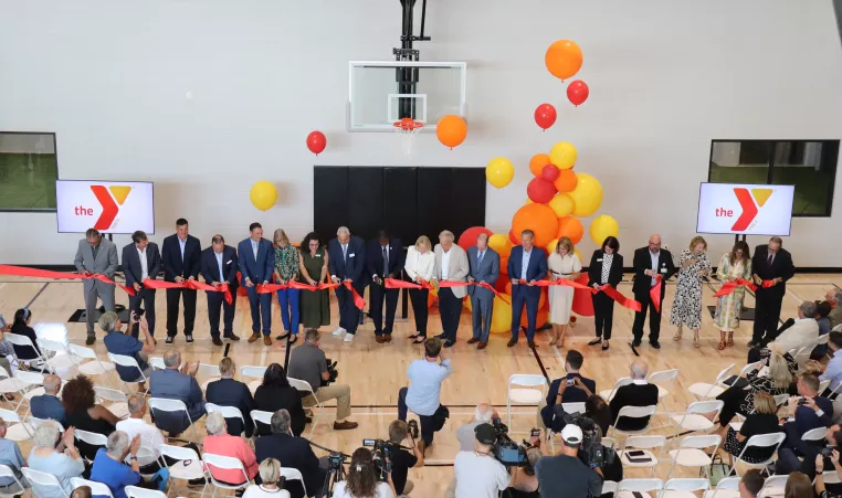 a photo of the ceremonial ribbon cutting at the sands family ymca
