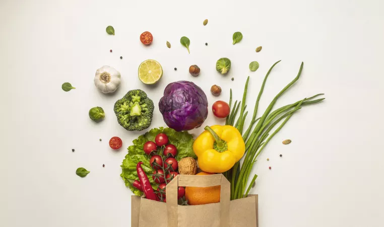 picture of a grocery bag of fruits and vegetables