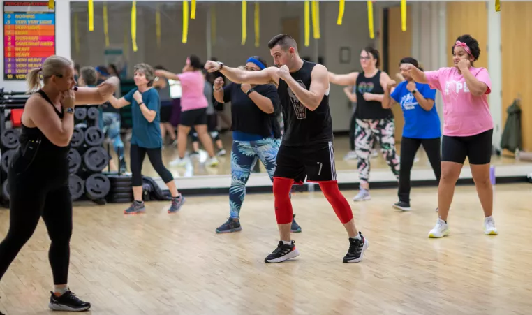 members of ymca of greater rochester take part in group exercise class