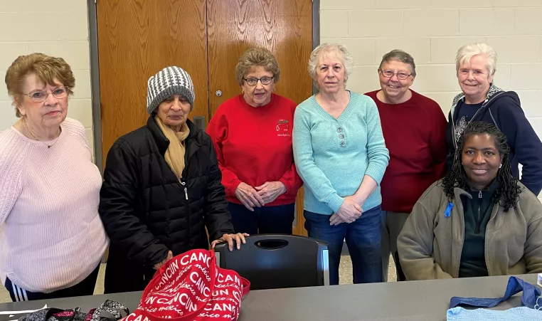 a group of members at the northwest family ymca pose for a picture during one of their handcrafting meetings