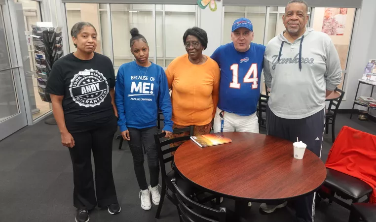 Members and staff at the Maplewood Family YMCA pose together during a grieving group session at the branch.