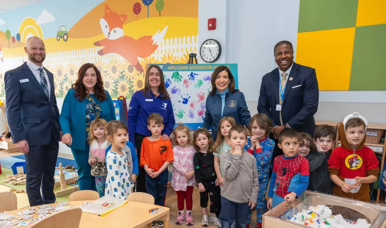 Group posing for photo in Irene Skalny Childcare Center