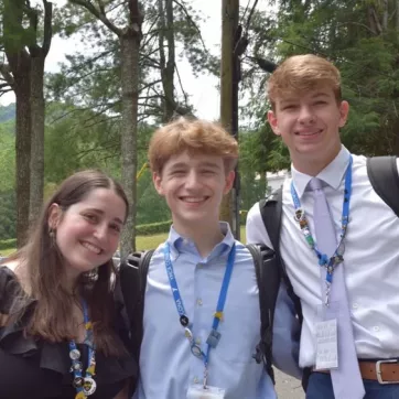 Three teens outside at a youth and government conference