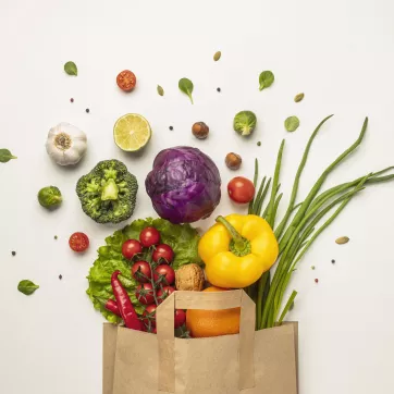 picture of a grocery bag of fruits and vegetables
