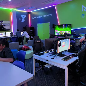 youth playing different video games inside the Metro Esports gaming lab at the Maplewood Family YMCA