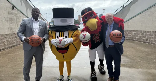 Gus Macker mascot the Macker Man poses for a picture with Spikes from the Rochester Red Wings and Ernie Lamour, President & CEO of the YMCA of Greater Rochester and Dan Mason, GM of the Red Wings