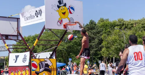 a player is dunking the basketball on the Top Men's Court