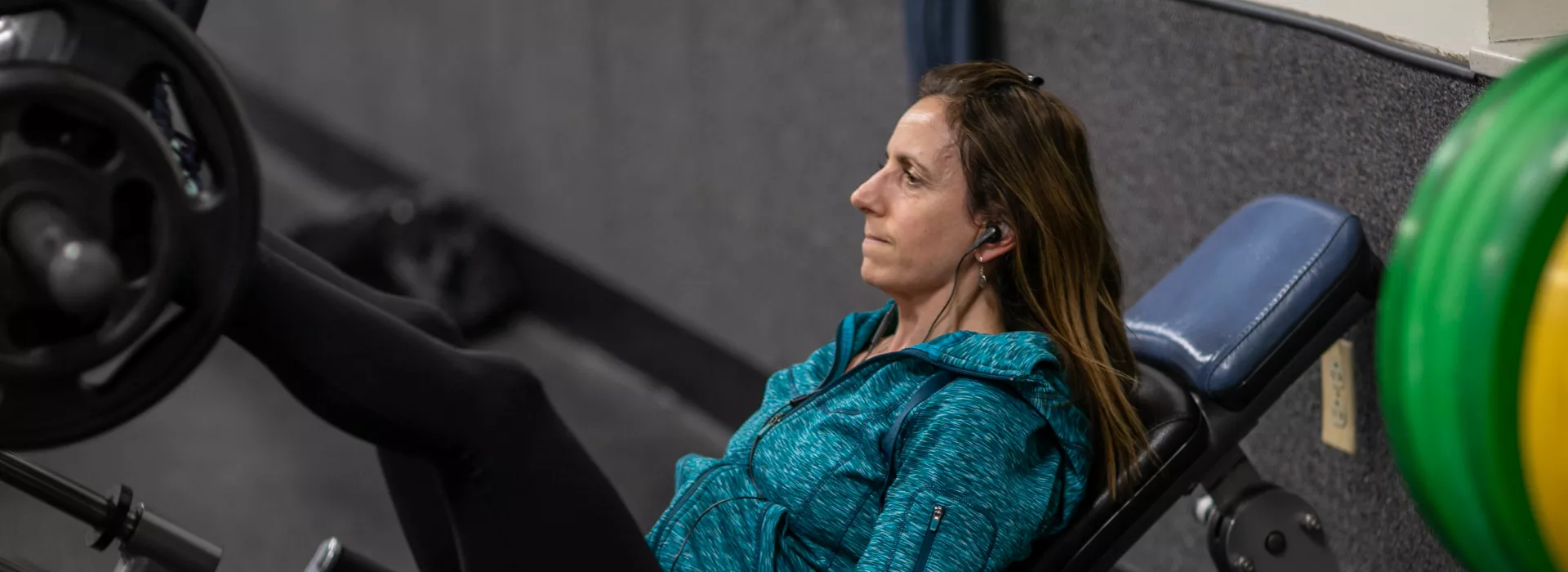 woman on a leg press machine at the northwest family ymca