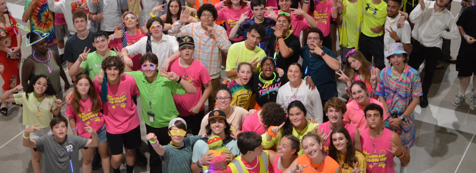 a large group of teens smiling at the camera