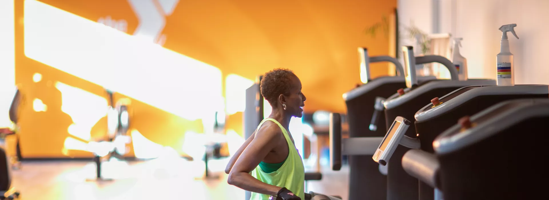 a woman using a piece of equipment from our egym strength training circuit
