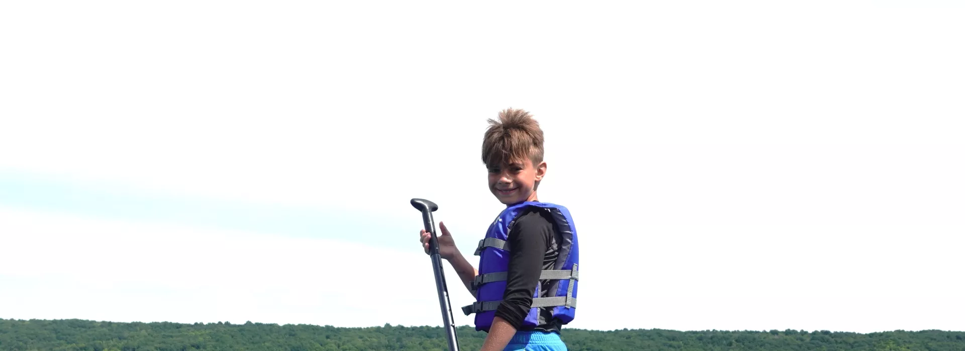 Kid Paddle Boarding at Camp Glacier