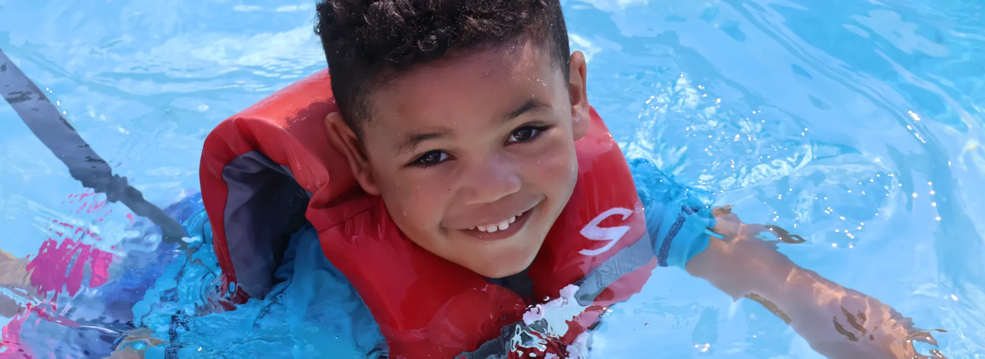 kid swimming at Camp Arrowhead