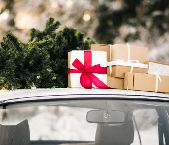 retro-car-with-gifts-christmas-tree-winter-snowy-forest-holiday-decor-santa-claus-delivery.jpg