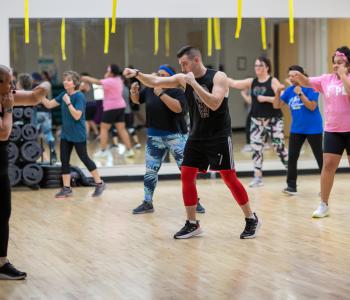 members of ymca of greater rochester take part in group exercise class