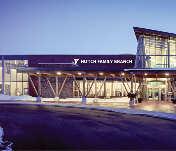 the outside of the current Eastside Family YMCA with the new name - Hutch Family YMCA - on the sign above the entrance