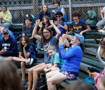 smiling and cheering campers and counselors
